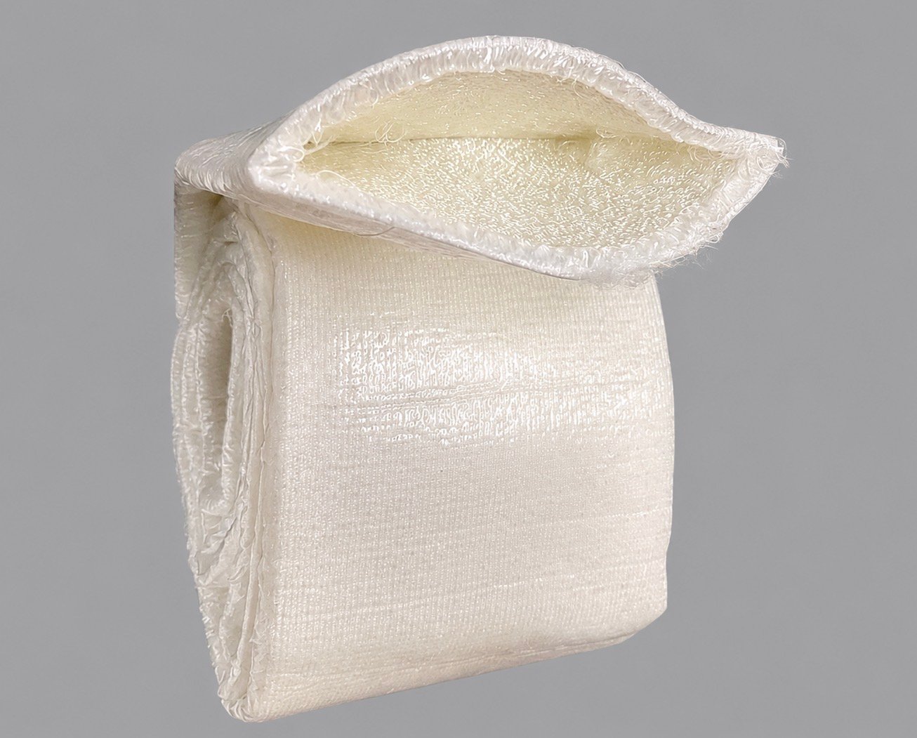 CIPP liner partially opened showing inner felt surface and outer coating before saturation