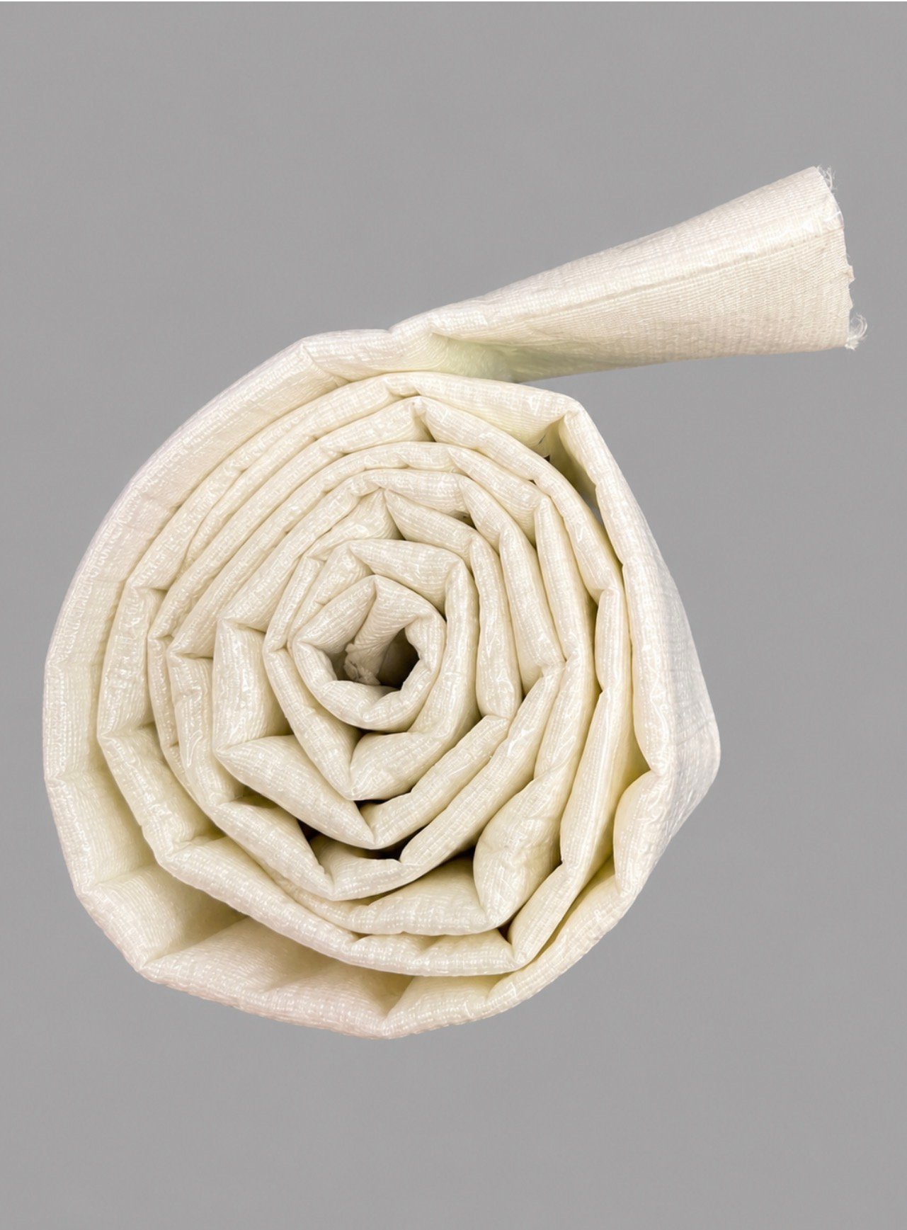 CIPP felt liner rolled up before saturation — white woven tube, pre-installation